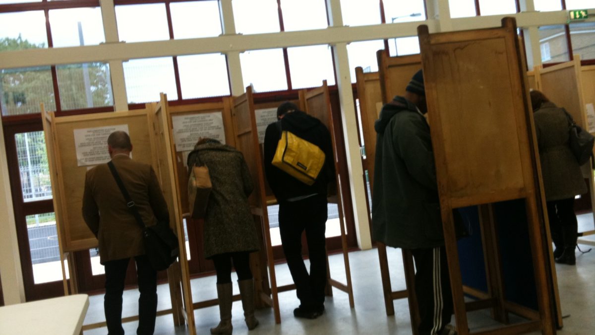 People voting in a polling booth
