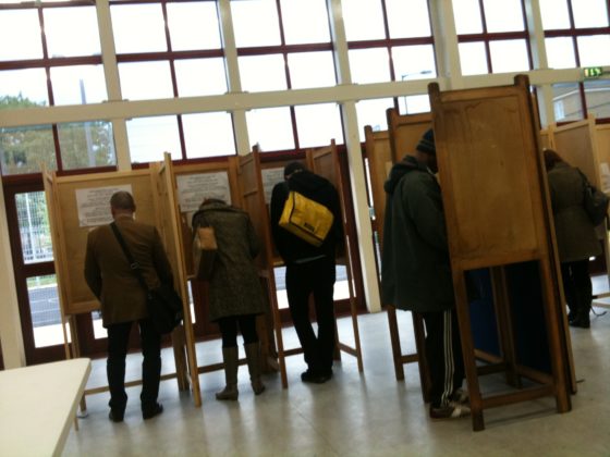 People voting in a polling booth