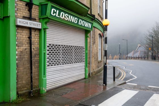 An image of a chuttered shop that says closing down