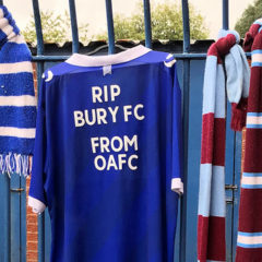 A football shirt reading RIP Bury FC