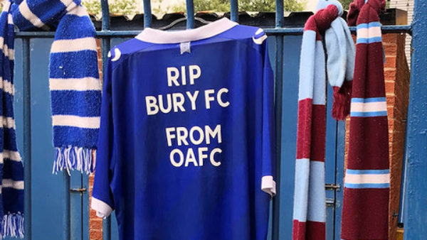 A football shirt reading RIP Bury FC