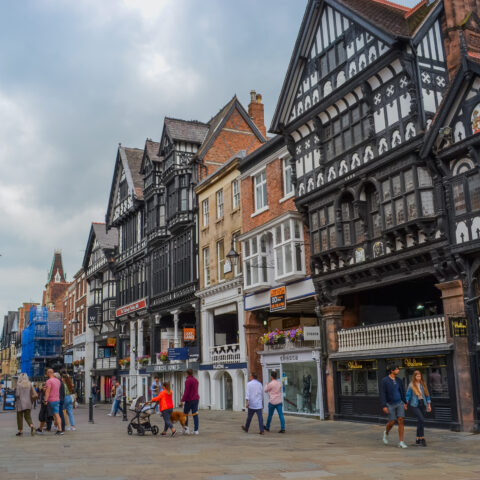 The main shopping street of the city with view to historic buildings. At the moment these are shops, cafes and pubs.